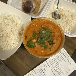 Butter chicken, rice, and samosa