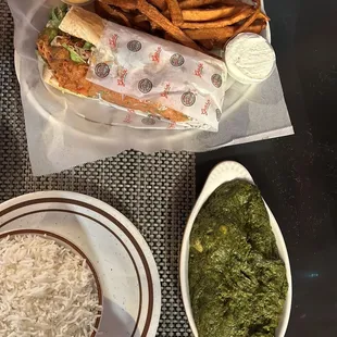 a plate of fries and a bowl of green sauce