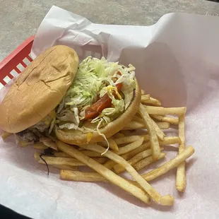 a hamburger and fries in a basket