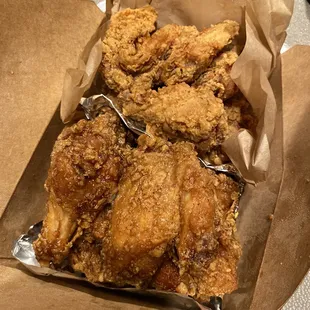 a basket of fried chicken on a table