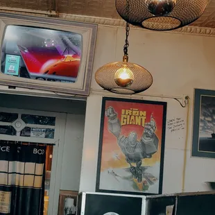 a television and a movie poster