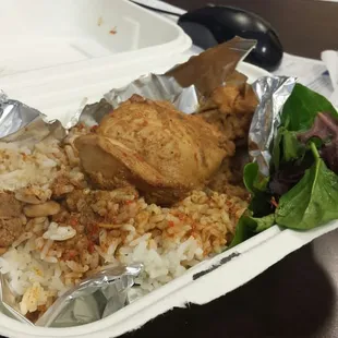 Spicy chicken rendang with jasmine rice and side salad.