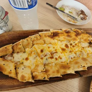 Beef pide.  Delicious!!!!!!! Feed one person with another one getting a couple of pieces "to taste"