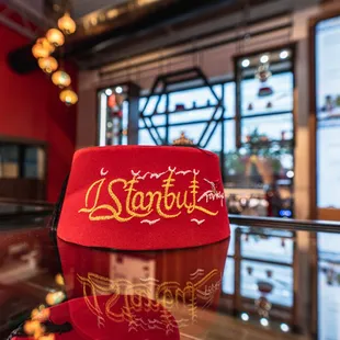 a red hat on a glass table