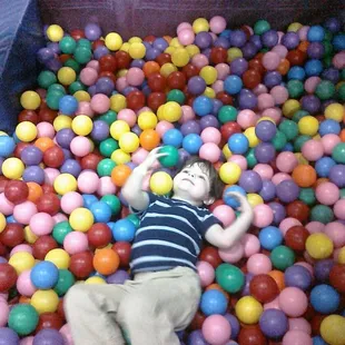 My son Gabriel in the ball pit at Galaxy Games and Golf on his first visit.