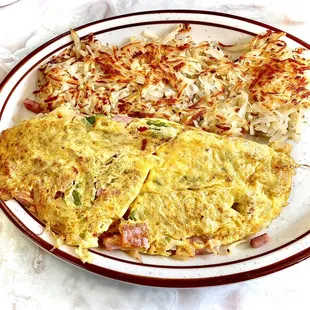 Western omelette: shredded onion, bell pepper, ham &amp; cheddar. Hash browns on side. Nice.