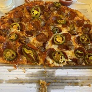 Medium pizza, with pepperoni, sausage, and jalapeños.