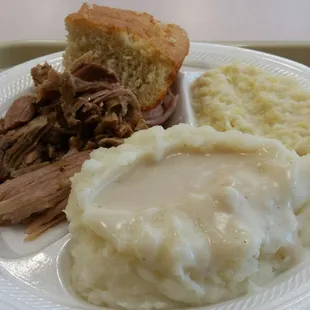 Pork roast, creamed corn, mashed potatoes with white gravy and baked cornbread.