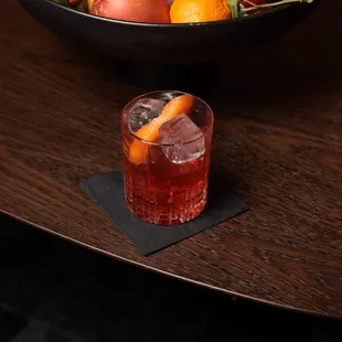 a bowl of fruit on a table