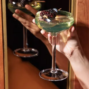 a person holding a glass of wine