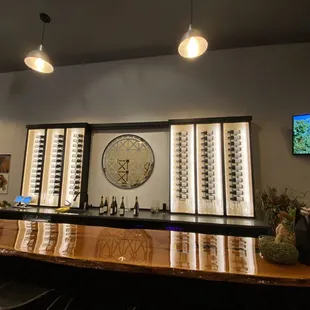 a bar with wine glasses on it