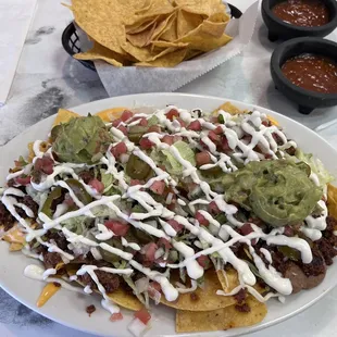 Nachos supreme with chorizo and hot salsa! Epic and delicious!