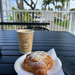 a cup of coffee and a pastry