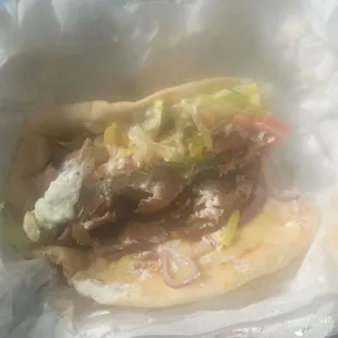 Large gyro with some of the meat already saved on the side