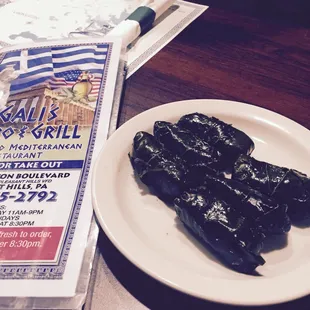 Grape leaves! First time trying them. They have a tangy taste..wish they served the meat ones. Wanted to try those instead.