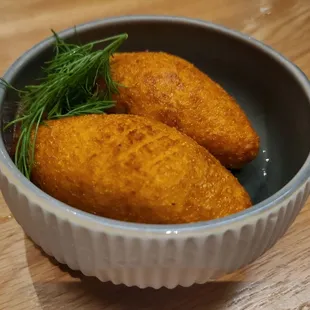 Iraqi Kubbeh Halab: crispy saffron crust, lamb, golden raisins, almonds