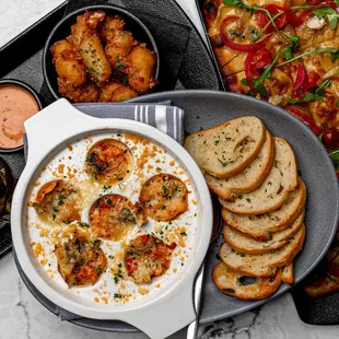 a plate of food with bread and dip