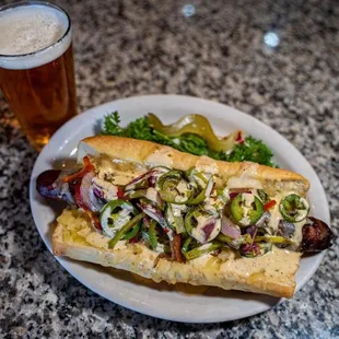 a plate of food and a glass of beer