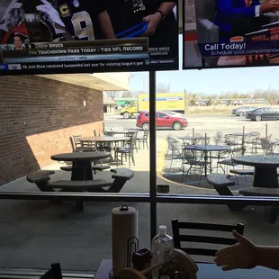 Tv's inside and outdoor dining