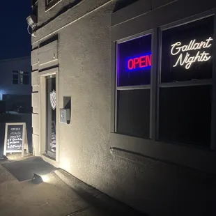 a neon sign outside a restaurant