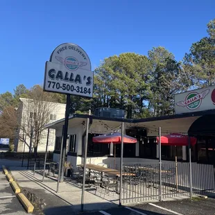 Sign and outdoor seating