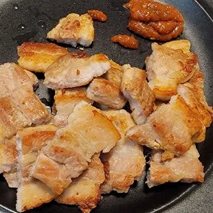 a plate of meat and nuts