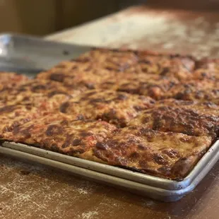 a pan of pizza on a table