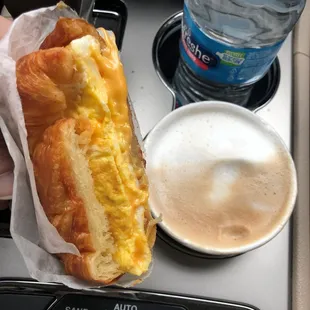2 eggs &amp; cheese croissant sandwich and a latte.