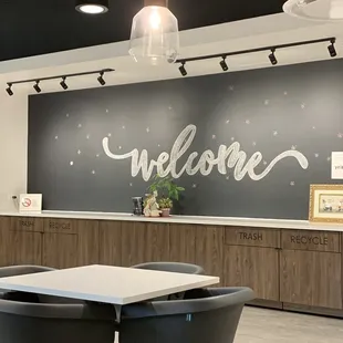 a welcome sign on the wall