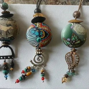 Klews' one of a kind polymer clay jewelry makes a great souvenir or gift!