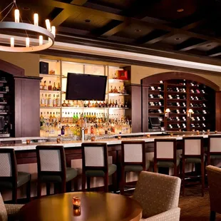 a bar with a lot of chairs