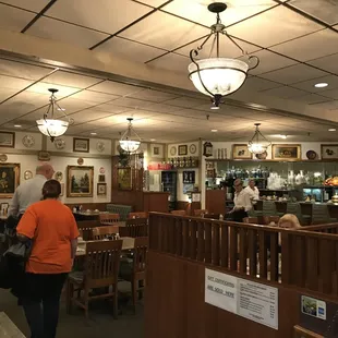 Tons of portraits and dinner plates adorned the walls