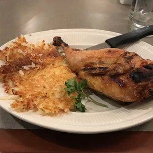 Half broiled chicken with hash browns