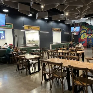 a restaurant with tables and chairs