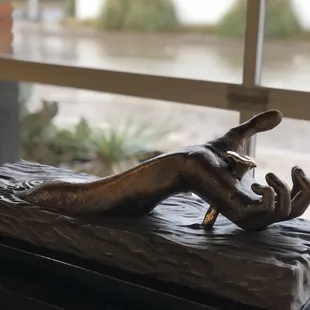 "Hand of Christ" - sculpture by Pat Green on a rainy day in Fort Worth