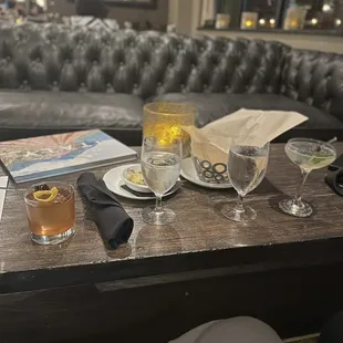 a table with drinks and a menu