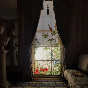 A painted window shade in the first floor salon