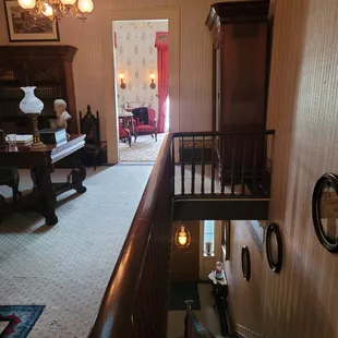 The view through the study into a small bedroom (upstairs) and the vestibule (downstairs).
