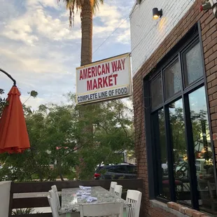 a table and chairs outside of a restaurant