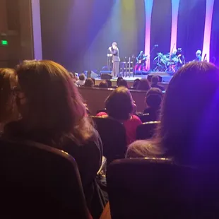 In thr first half of the show Lea Salonga wearing a black suit dress pants attire.