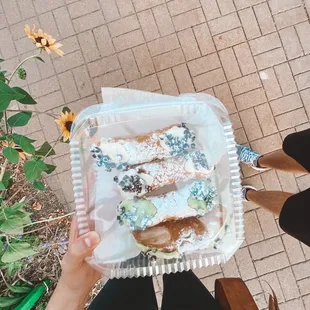 Pistachio cannolis and regular cannolis