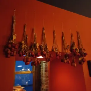 a bunch of garlic hanging from the ceiling