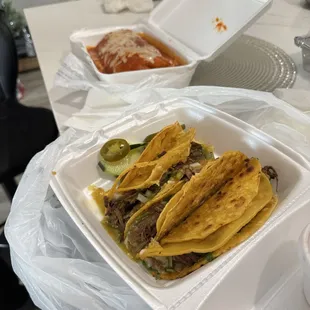 A wet Super burrito !!! And three quesadbirria taco!! Omg!! Very tastie!!!