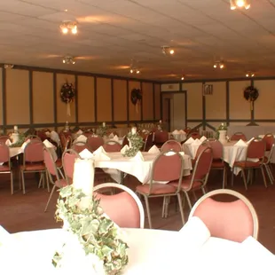 a banquet room with tables and chairs