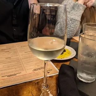 a glass of wine on a table