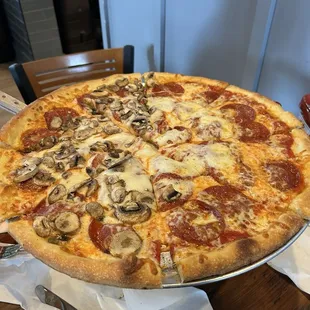 Pepperoni pizza with extra cheese and half mushroom