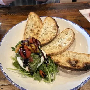 Burrata-Pistachio pesto, tomato chutney, Sicilian olive oil, served with toasted crostinis