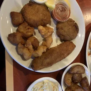 Fried seafood platter- deviled crab, fried flounder, fried shrimp and fried scallops with red potatoes and Cole slaw