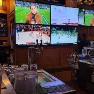 a bar with multiple televisions