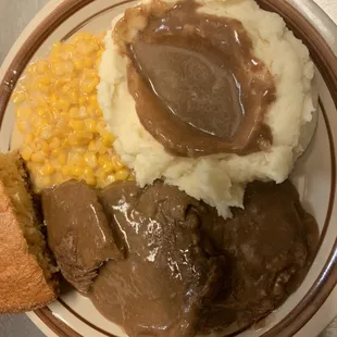 Roast beef with brown gravy mashed potatoes cream corn